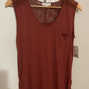 Brown top, cute design in the back, great material
